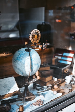 blue globe map on table
