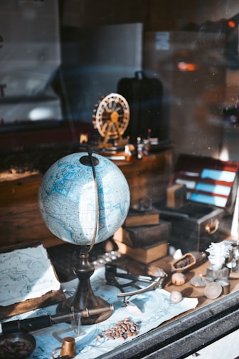 blue globe map on table