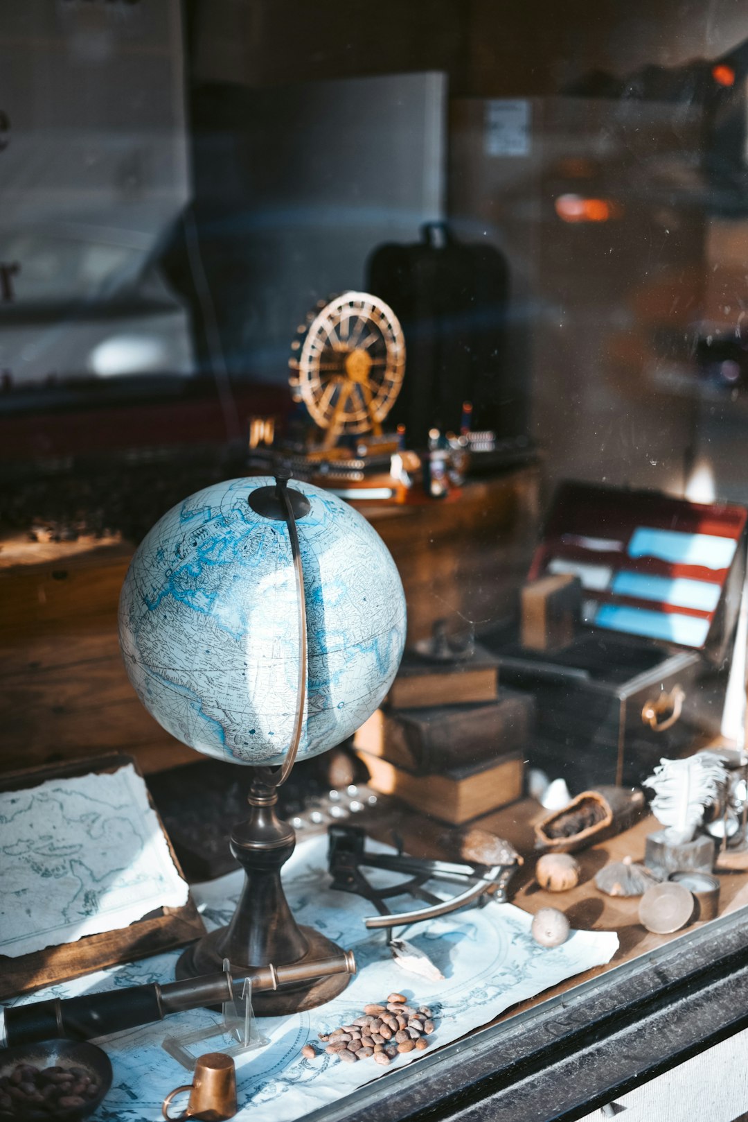 blue globe map on table