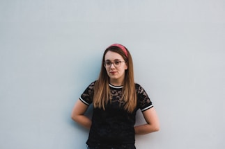 woman leaning on wall