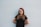 woman leaning on wall