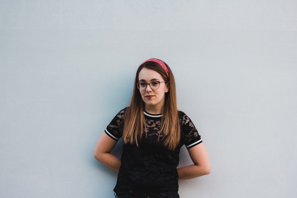 woman leaning on wall