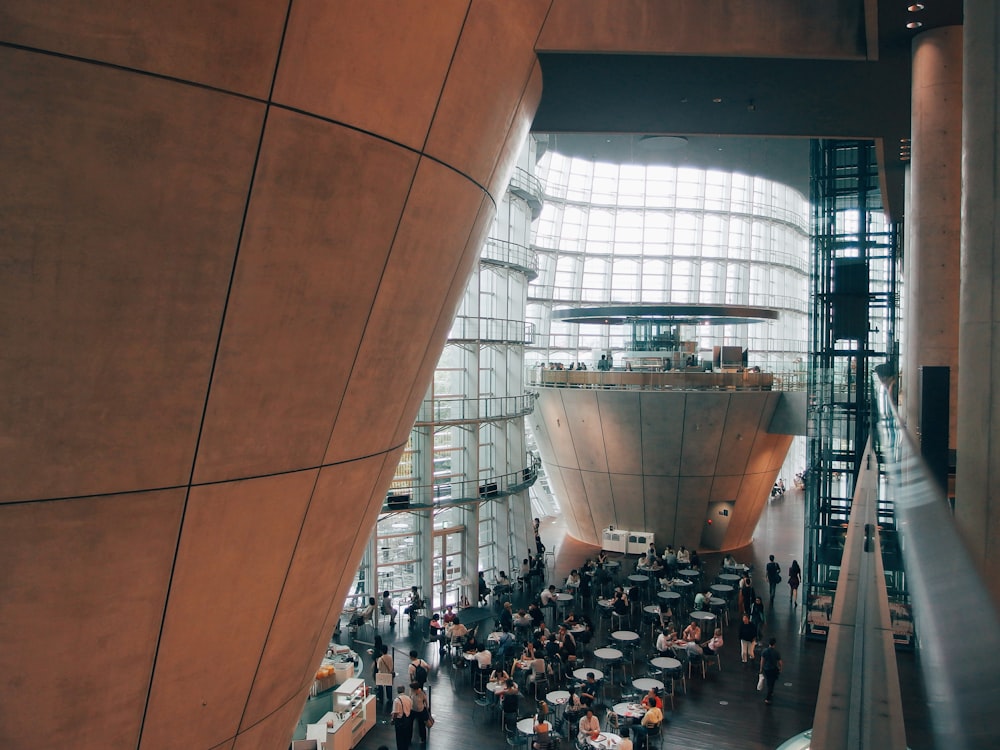 a group of people standing inside of a building