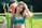 woman in blue crop top posing for picture
