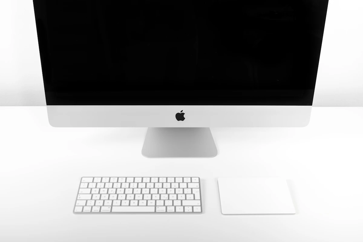 All-in-one desktop computer with keyboard on a white studio background