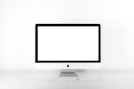 silver iMac with Apple Magic Keyboard on white sufrace