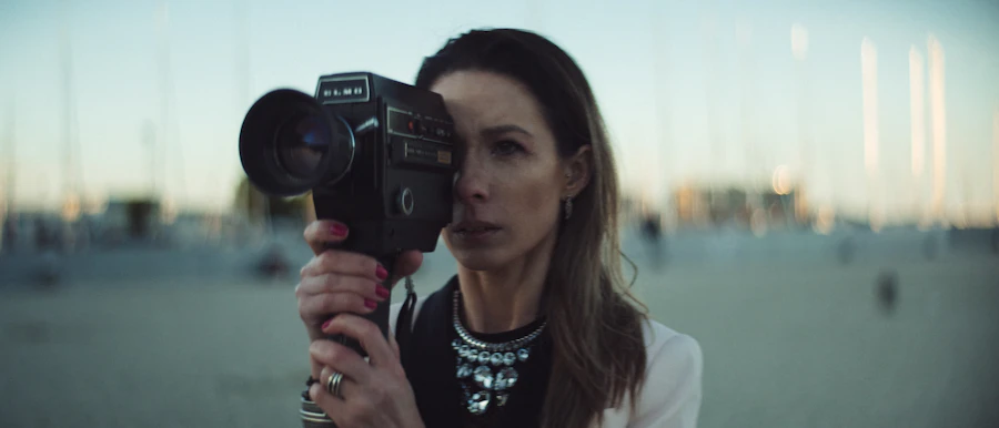 Creator filming detailed footage with a camera