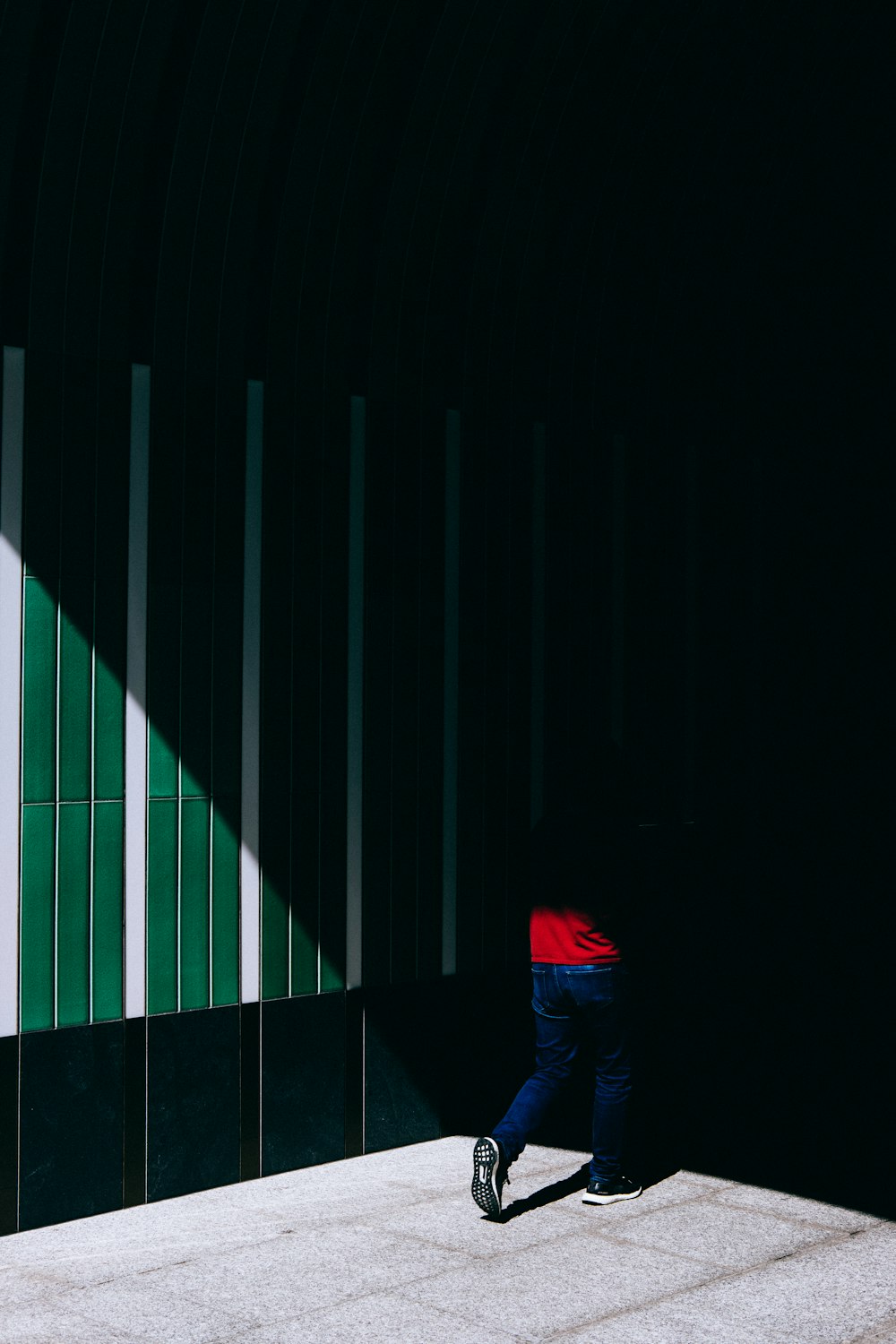 person walking on road path