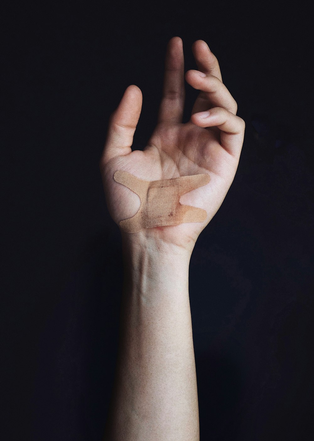 person's left palm with bandage