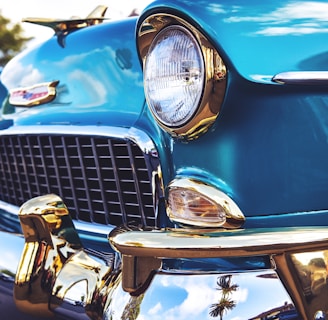 selective focus photography of blue Chevrolet Bel Air