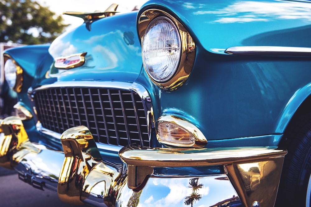 selective focus photography of blue Chevrolet Bel Air