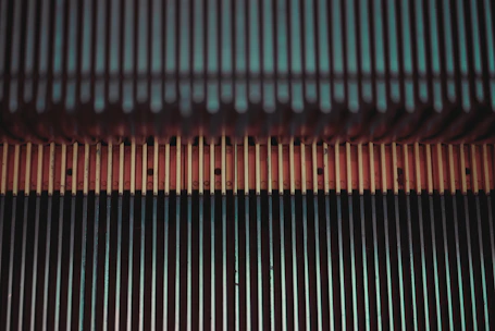 Close-up of the compact DC brushless motor installed at the base of a staircase.