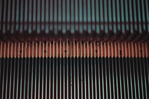A technician repairing an escalator with tools and equipment.