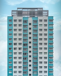 teal and white high-rise building