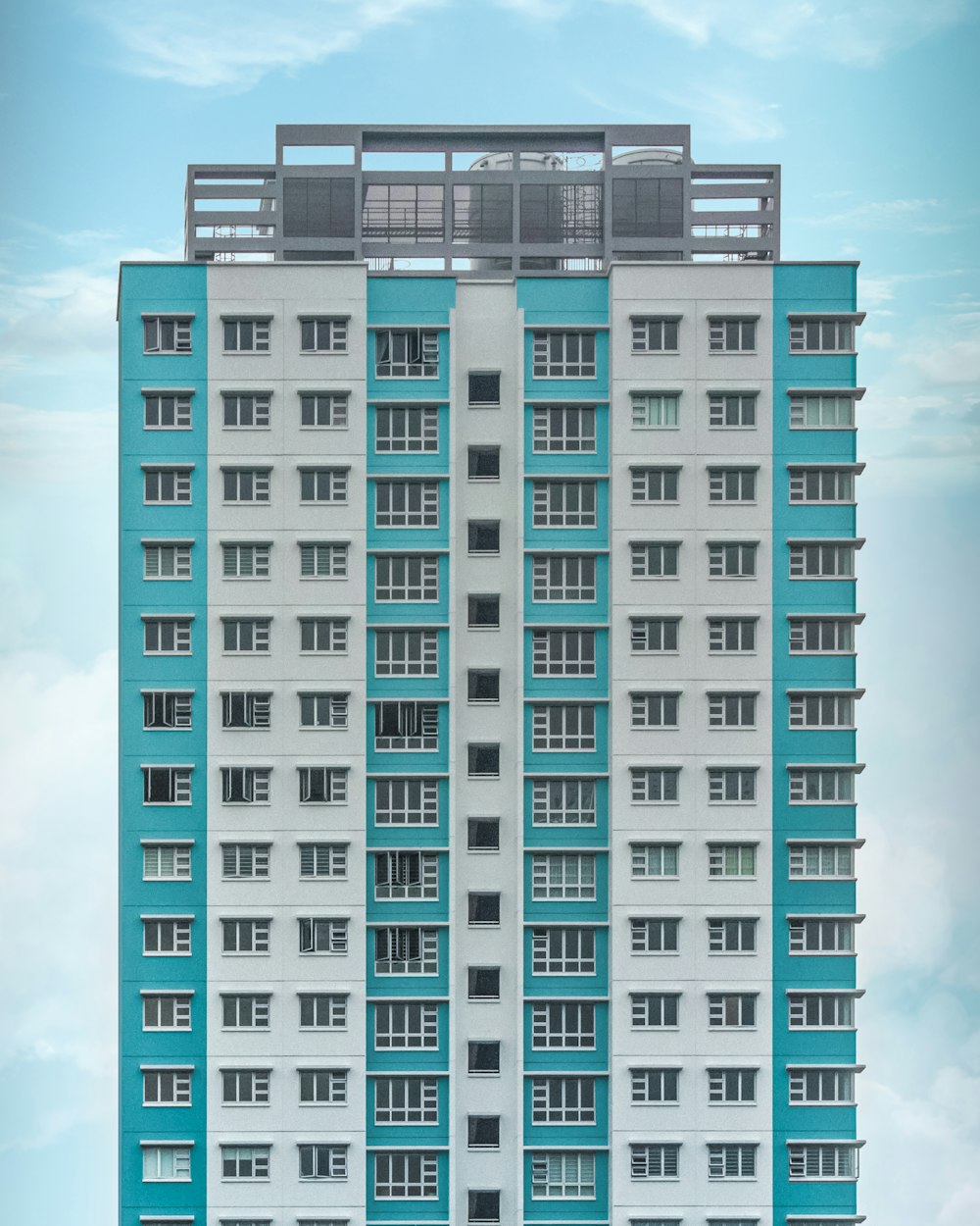 teal and white high-rise building