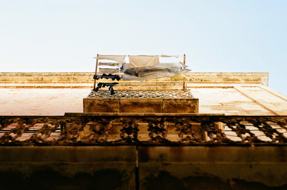 worm's-eye view of balcony with laundry hangings