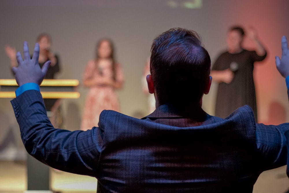 man leading choir