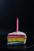 slice of cake with candle on top