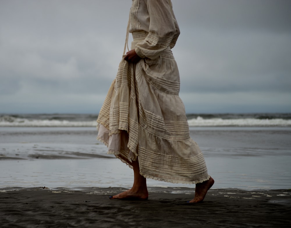 woman walking on seashore