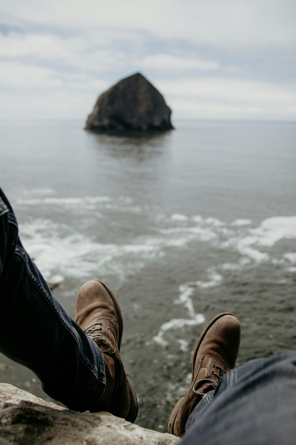 person sitting on rock formation