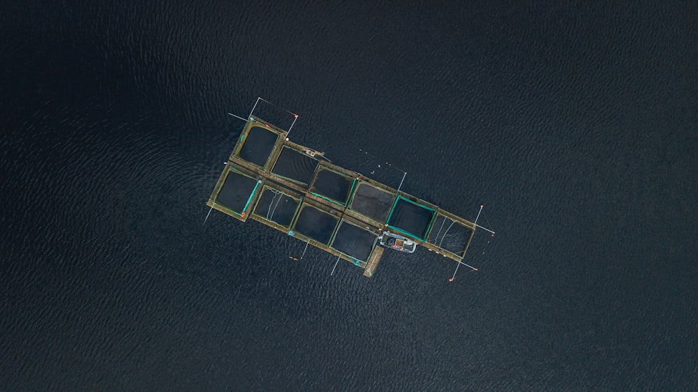 aerial photography of fish pen at daytime