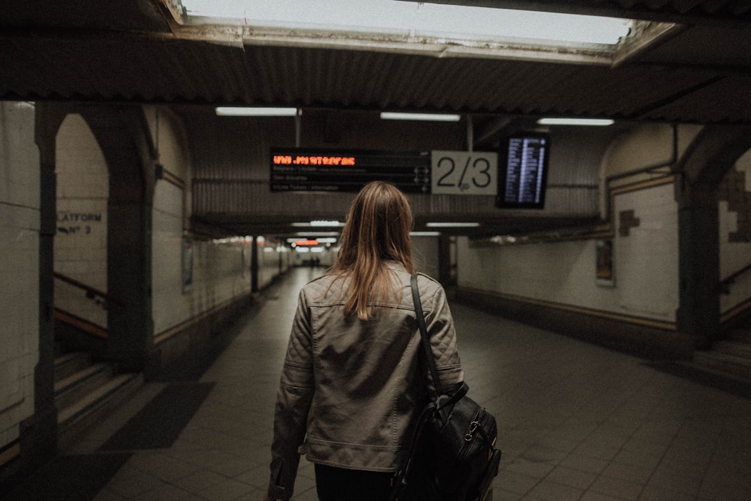 woman standing under tunnel