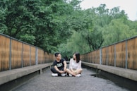 A peaceful natural setting where two people are quietly sharing a meaningful conversation.
