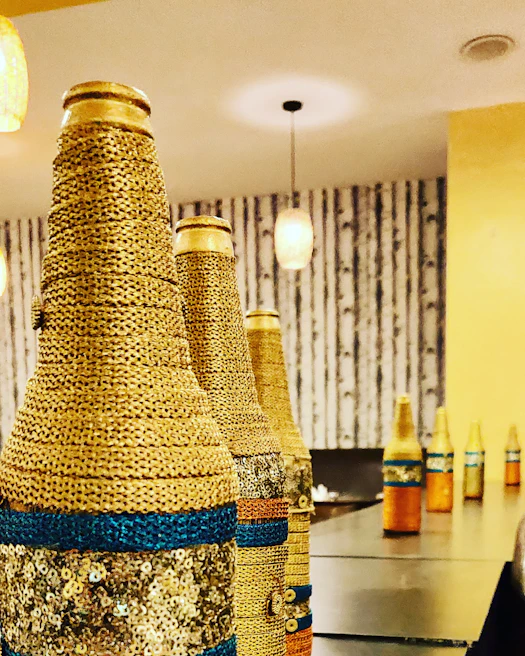 Elegant personalized water bottles displayed with cheerful yellow and orange accents in a bright setting