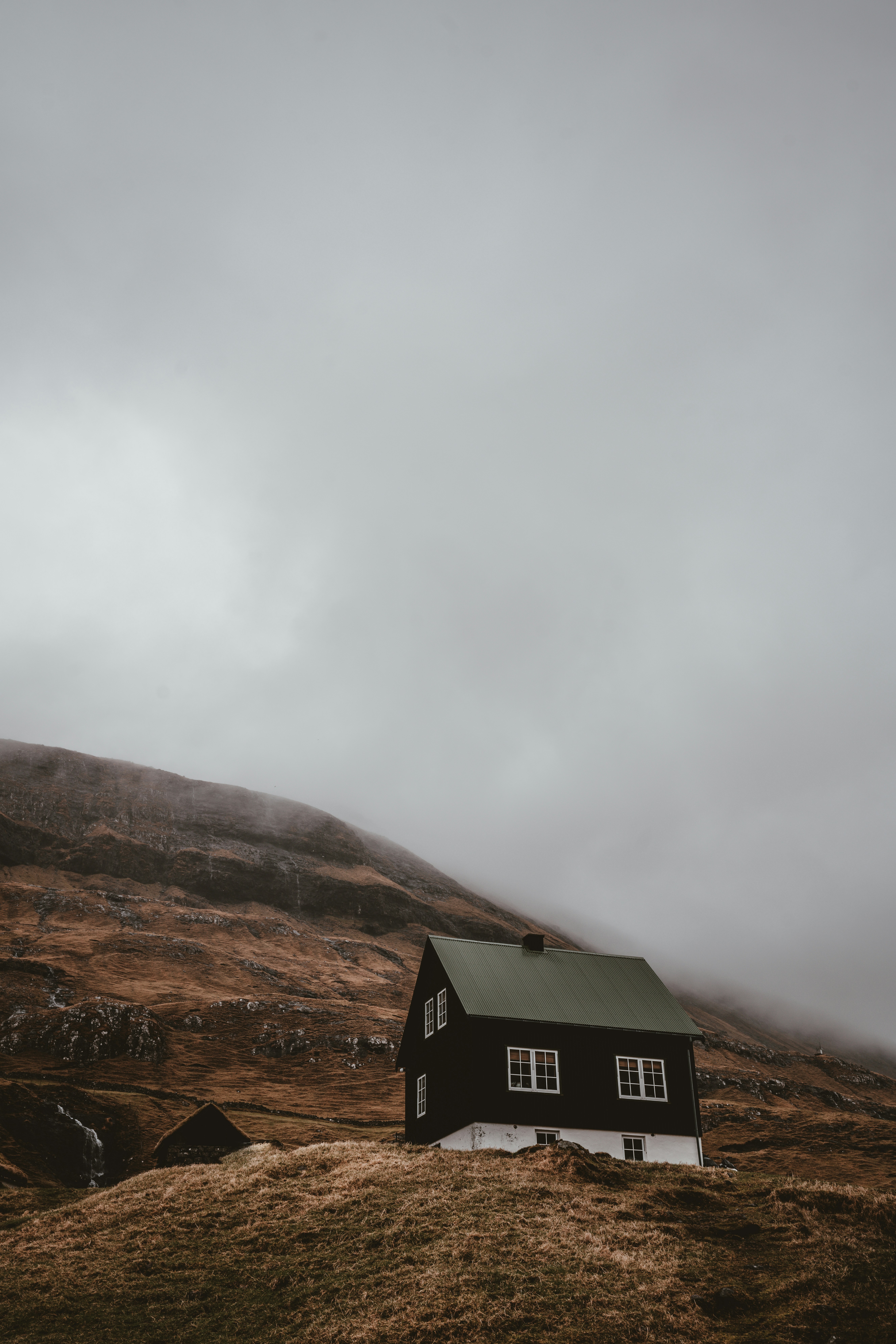 black and white house on mountain