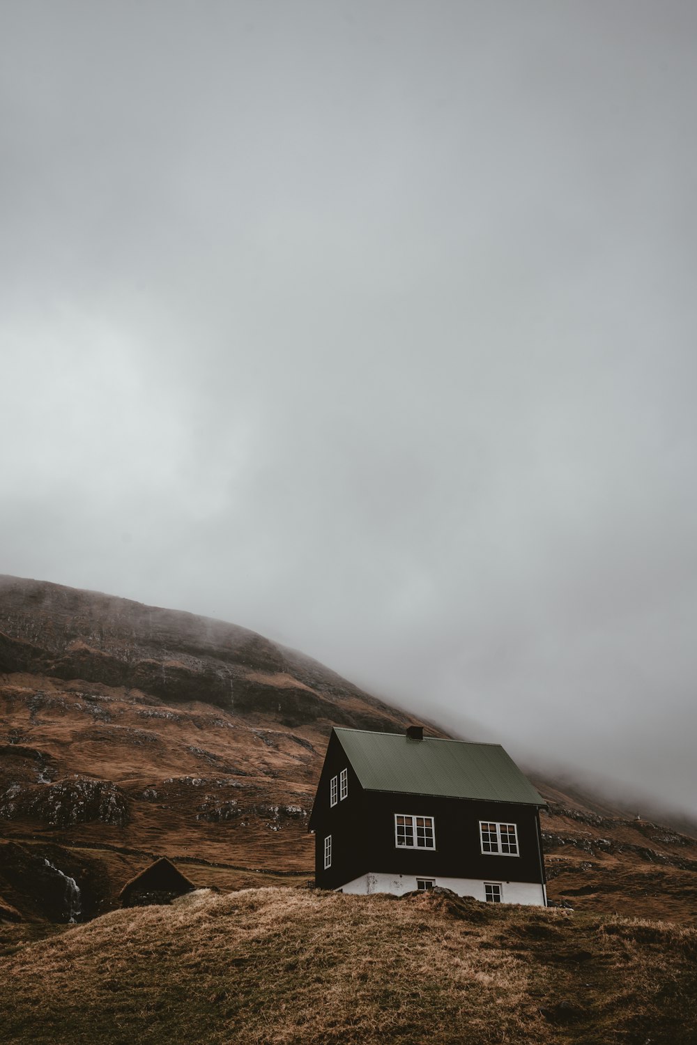 black and white house on mountain