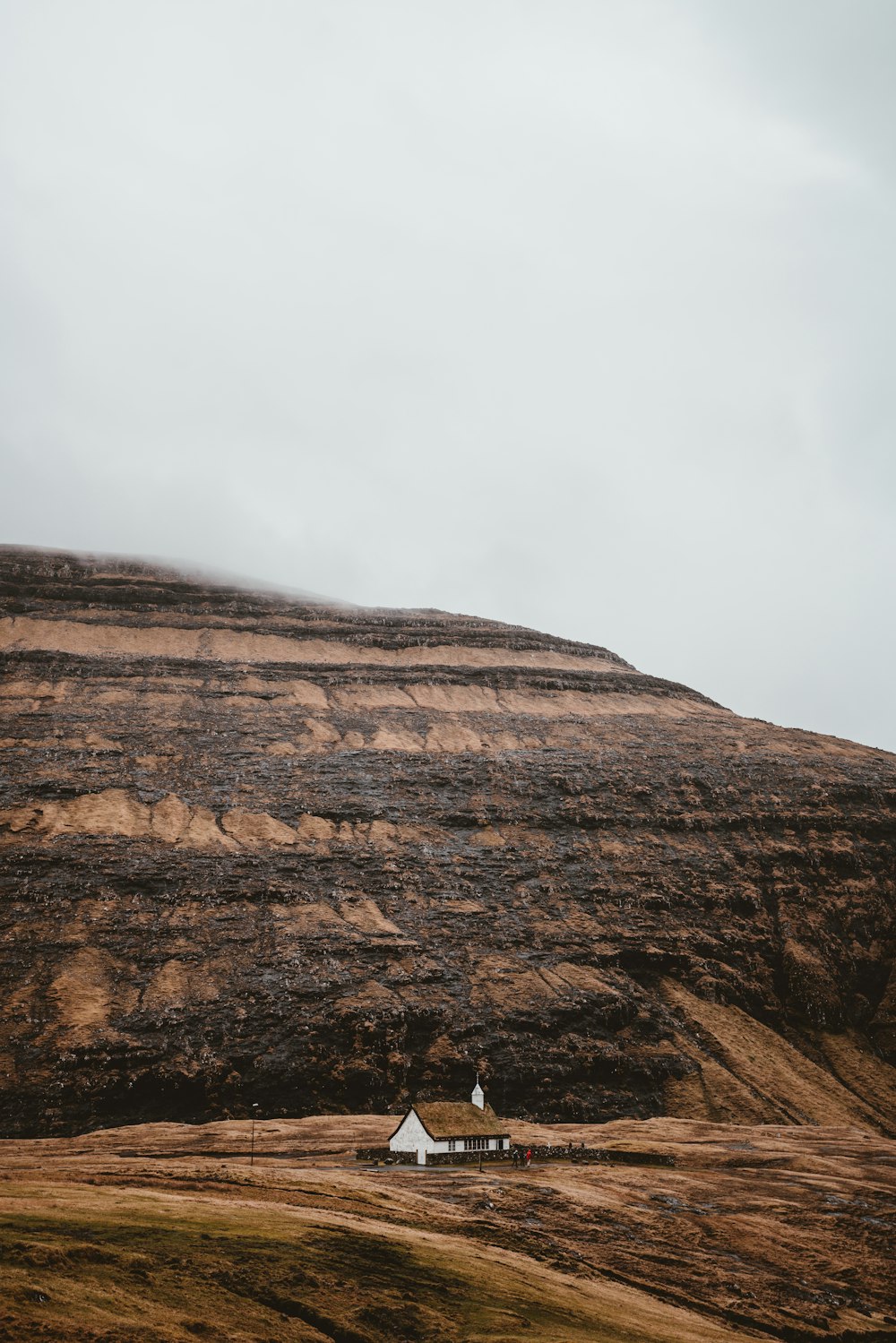 a hill with a house on top of it