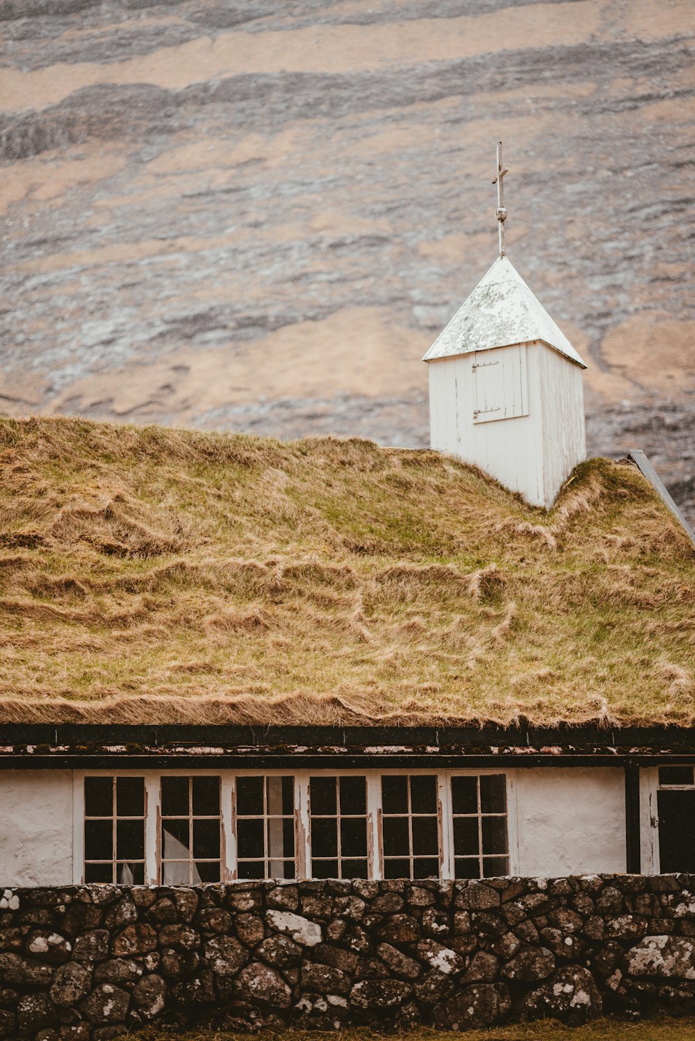 white chapel near the mountain