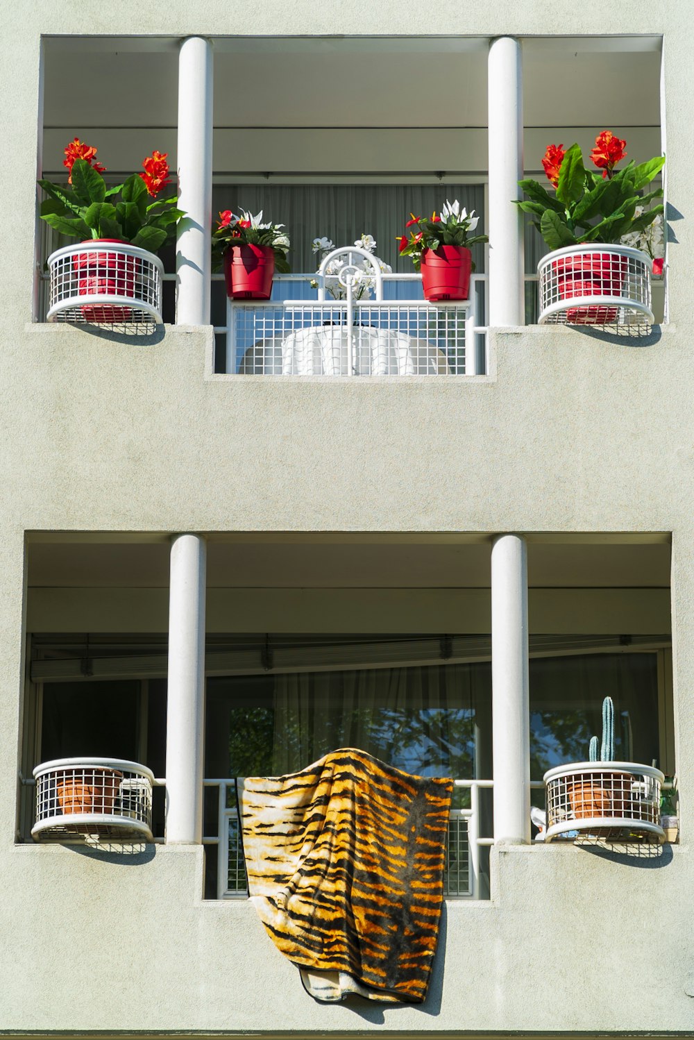 a building with two balconies on the windows