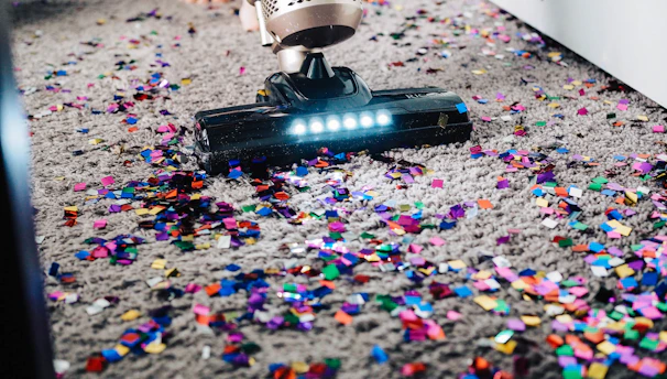 Close-up of a professional vacuuming dust from air ducts.