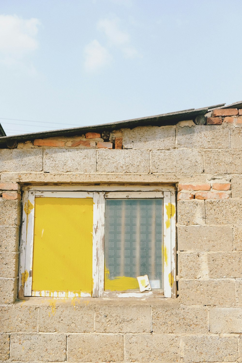 house with yellow and white windowpane