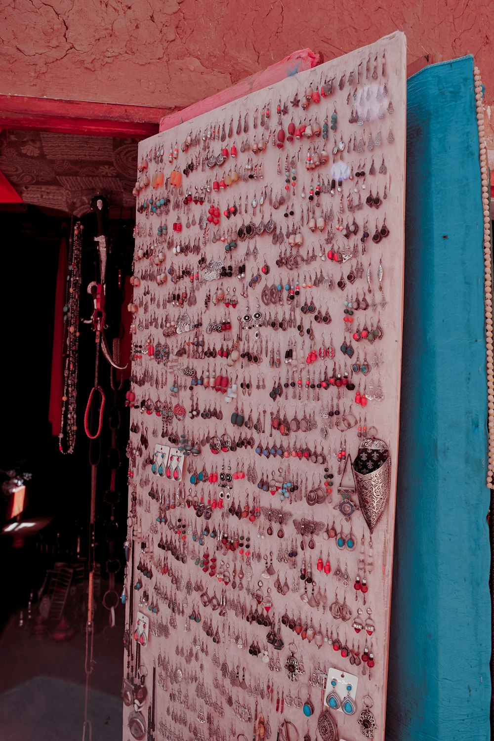 assorted earrings on white board