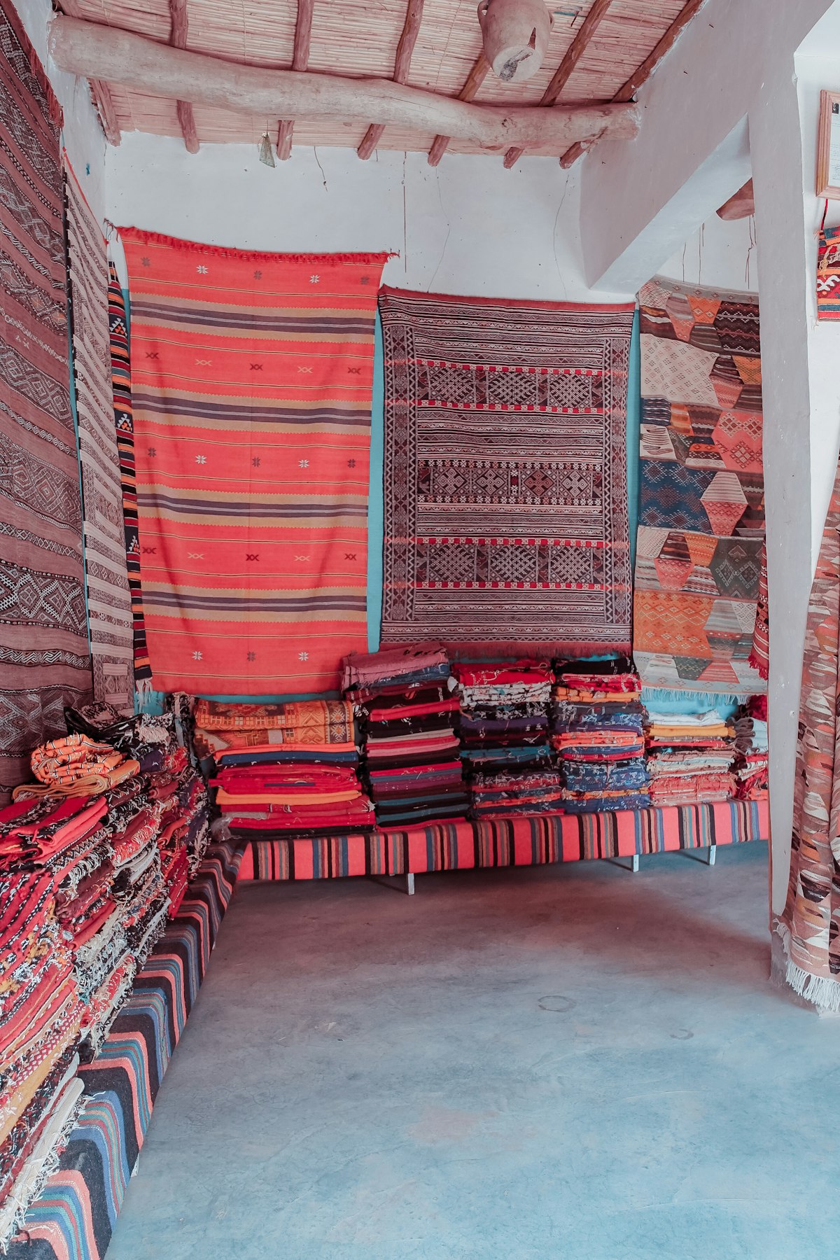 Colorful Indian fabrics stacked in a market