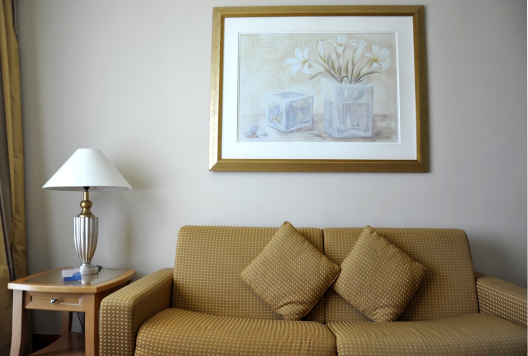 two brown throw pillows on ciuch, Cosy hotel room