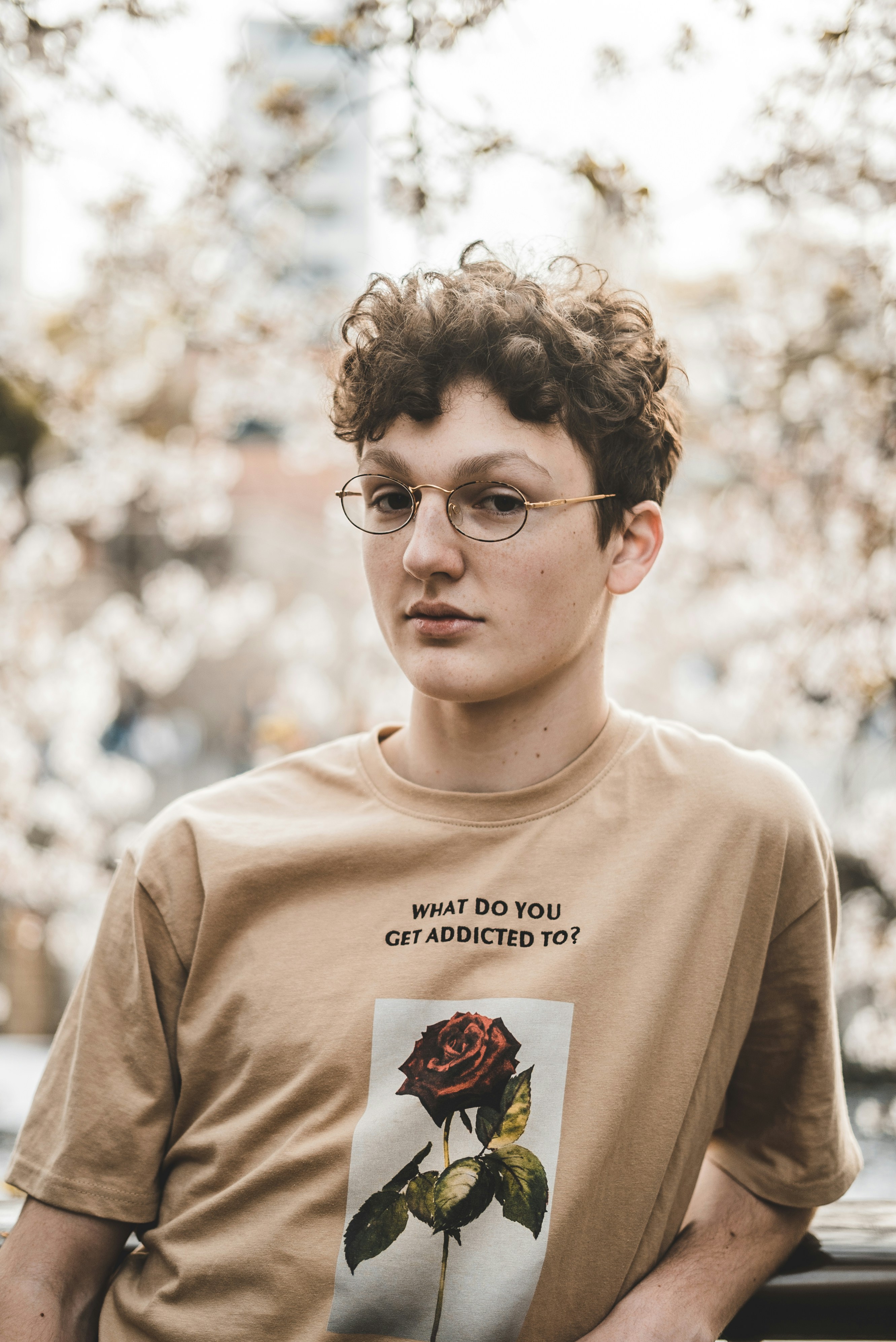 a short curly non-binary haircut