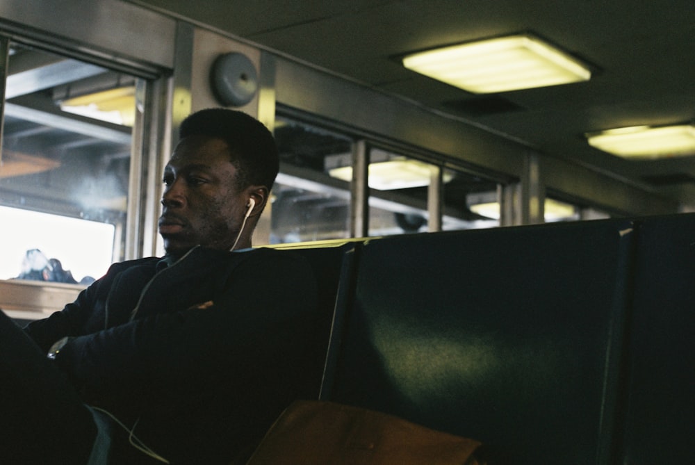 man wearing white earphones