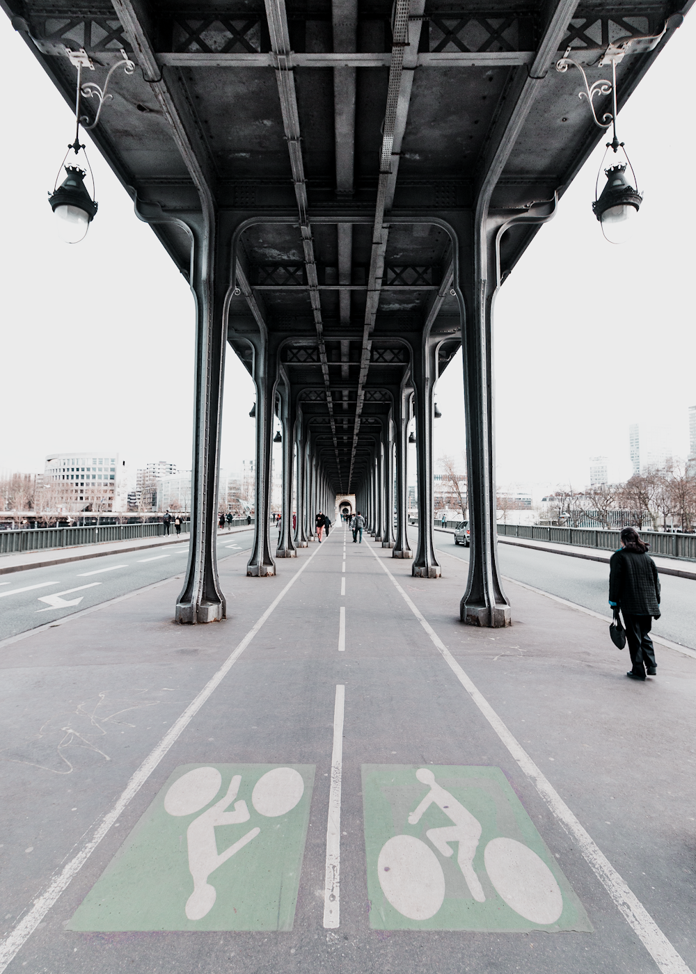 person walking beside bike lane