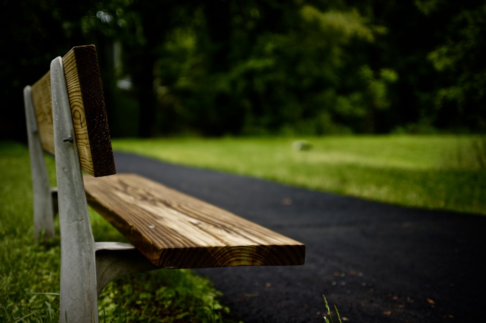 rule of thirds photography of brown bench