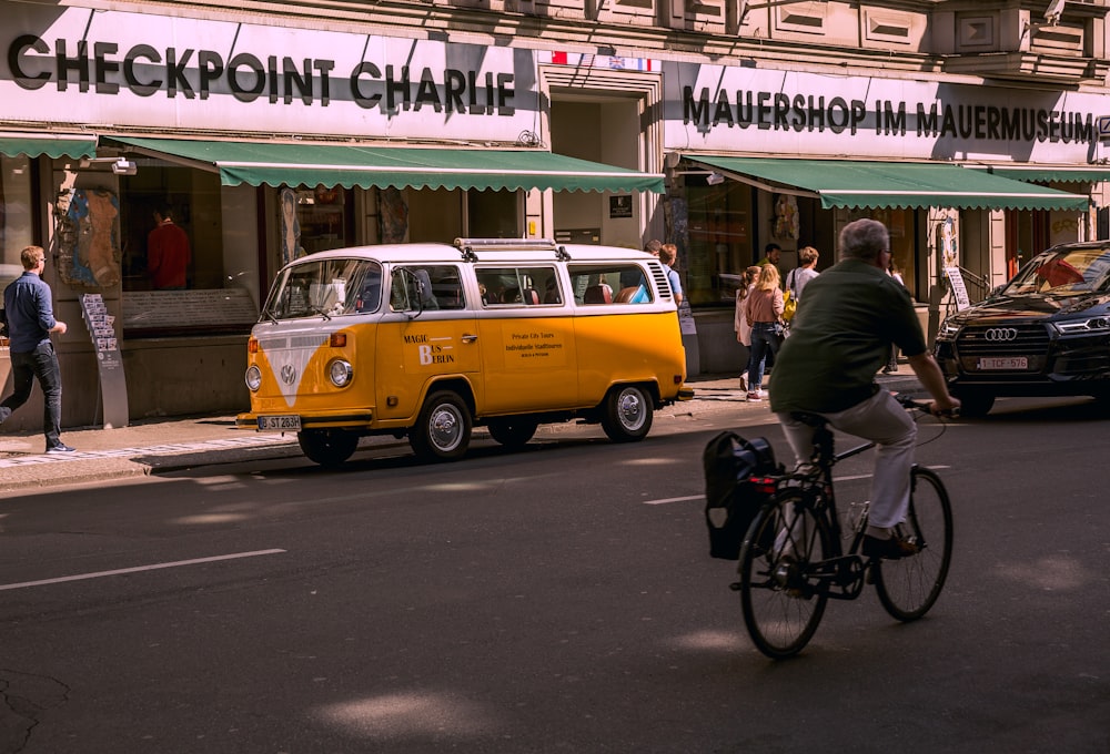 man riding bicycle on road