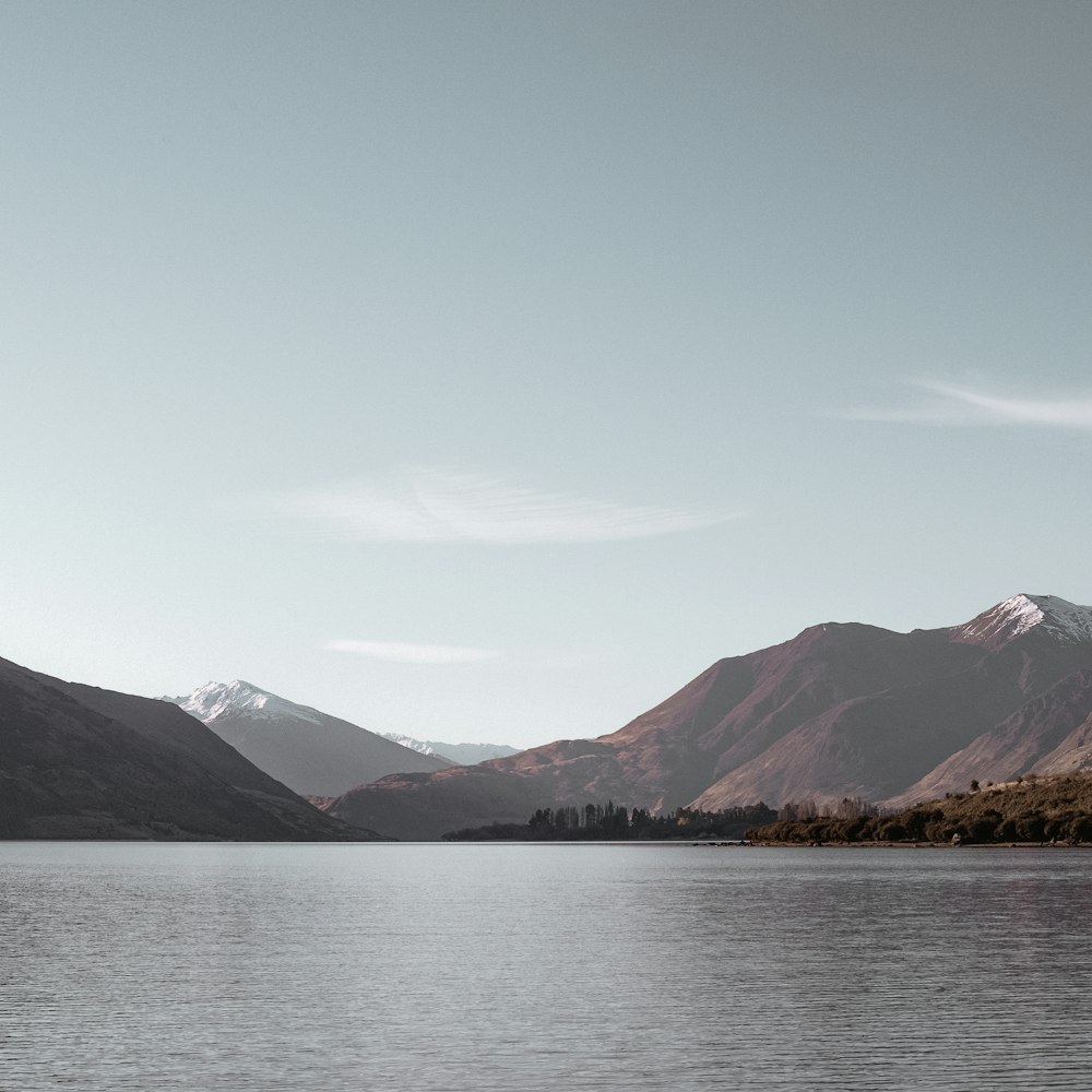 landscape photography of body of water with mountains