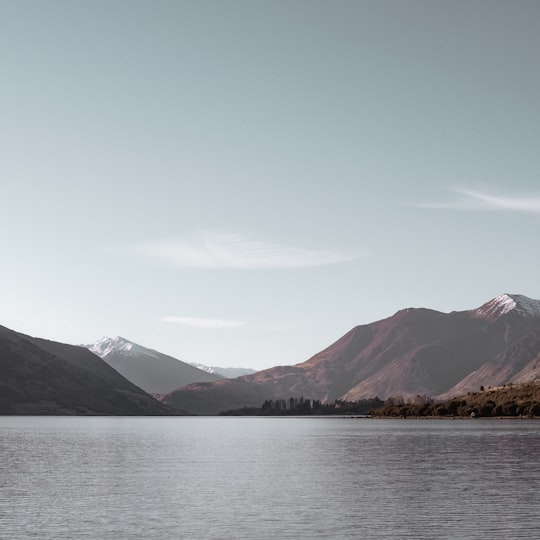 landscape photography of body of water with mountains in Lake Wanaka New Zealand