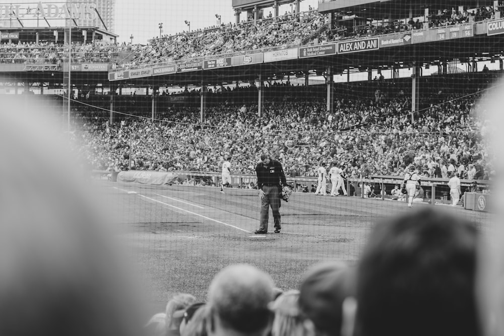 grayscale photography of people playing baseball