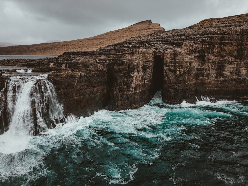 photo of rock formation with falls