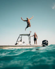 man diving on pool
