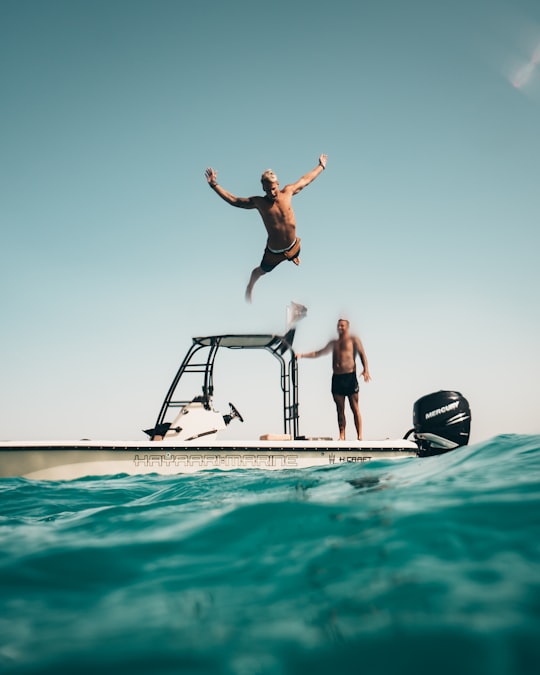 man diving on pool in Abu Dhabi United Arab Emirates