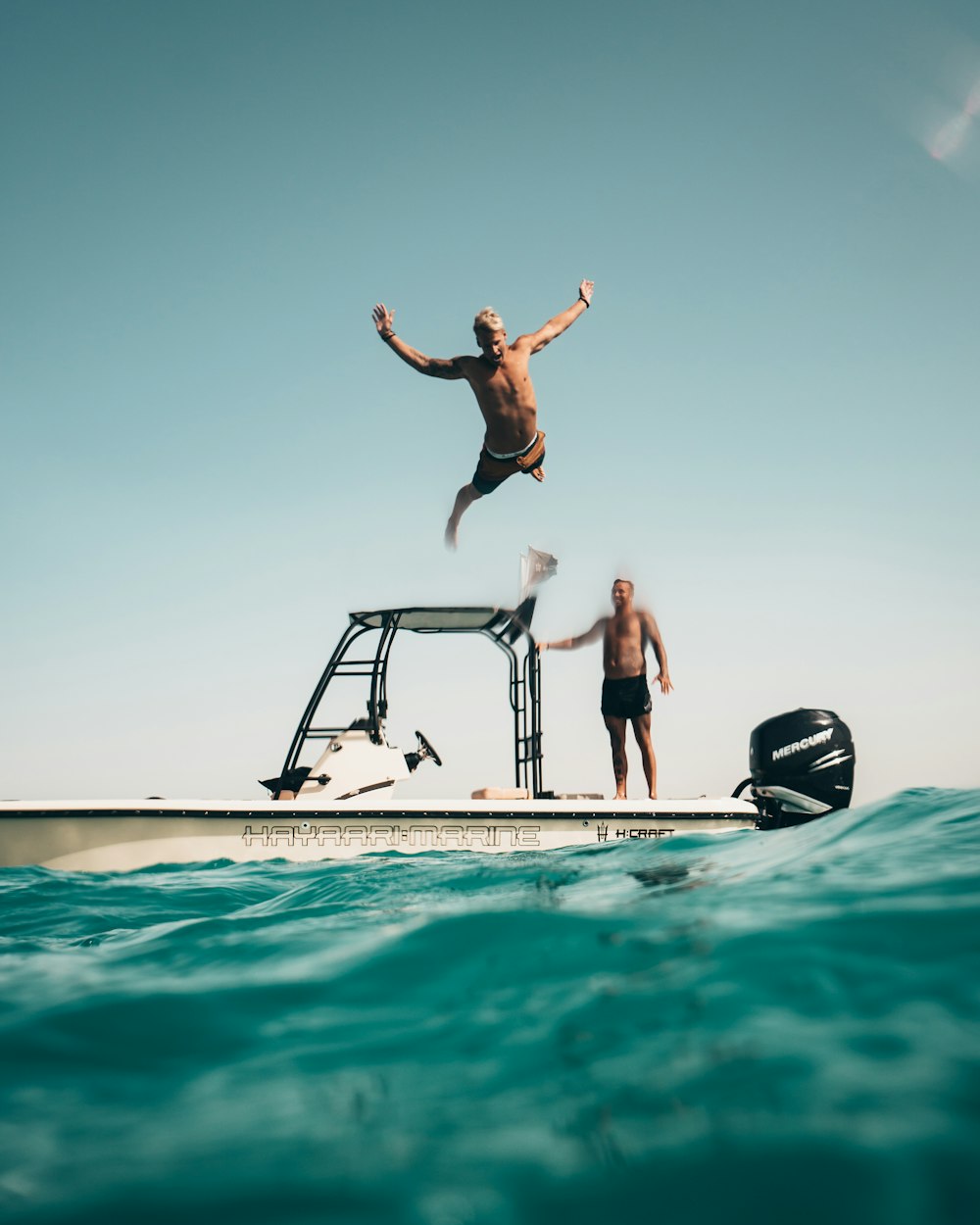 man diving on pool